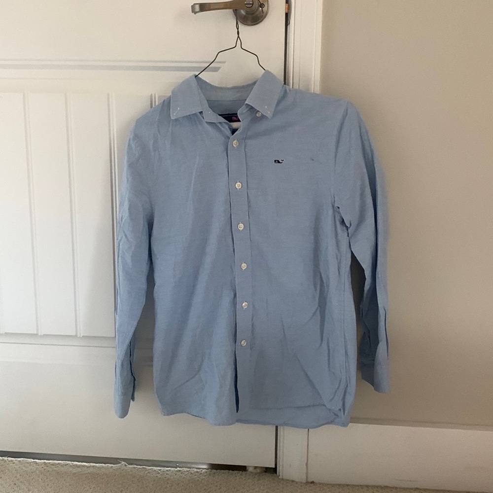two boys collard shirts.  One white one blue.